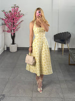 Vestido midi amarillo floreado