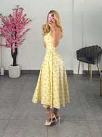 Vestido midi amarillo floreado