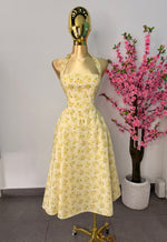 Vestido midi amarillo floreado
