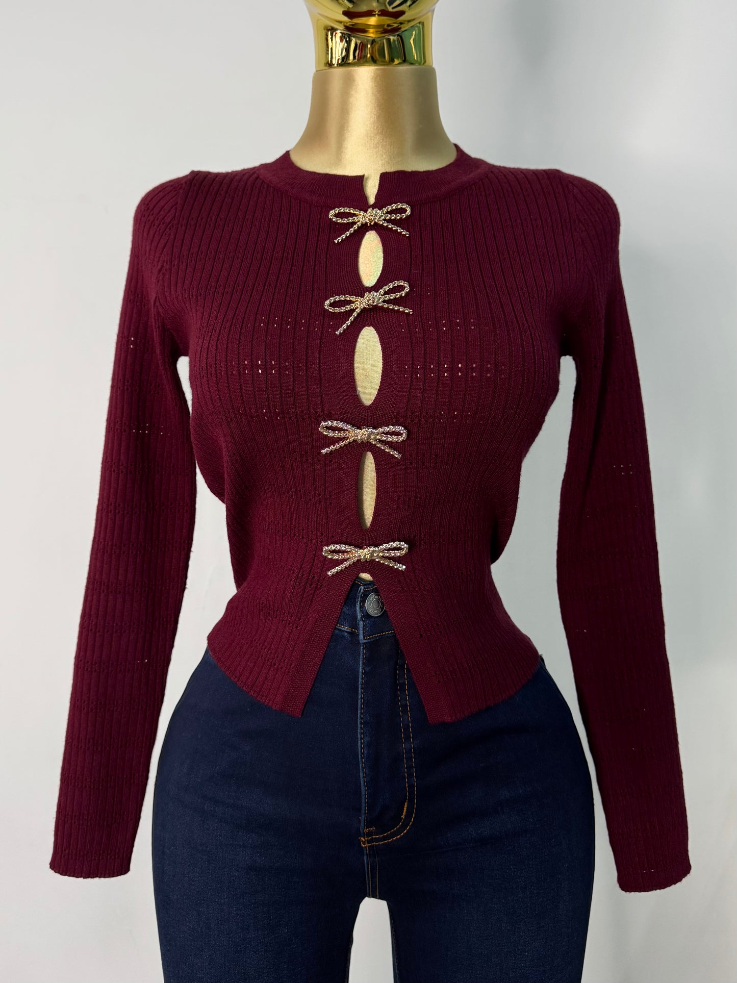 Sueter vino moños dorados