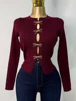 Sueter vino moños dorados