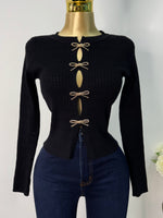 Sueter negro moños dorados