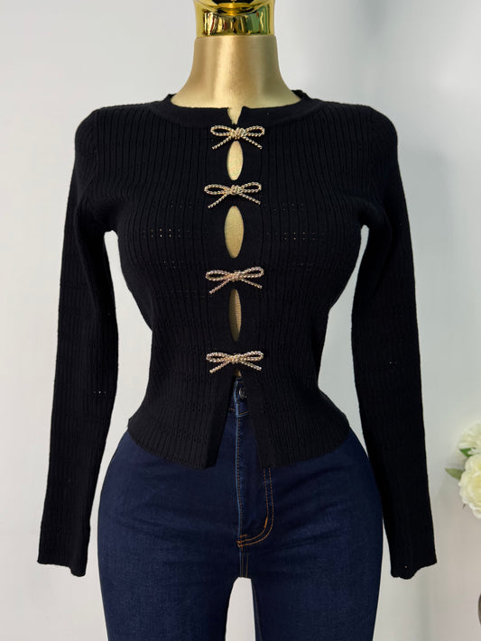 Sueter negro moños dorados