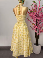 Vestido midi amarillo floreado
