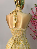 Vestido midi amarillo floreado